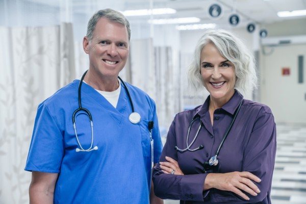 Portrait of smiling Caucasian doctors in hospital