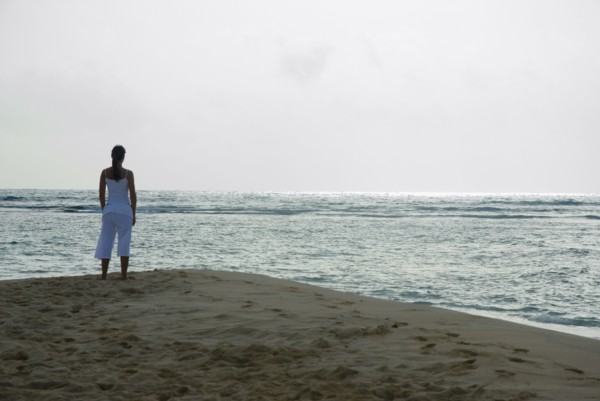 Woman looking out over ocean