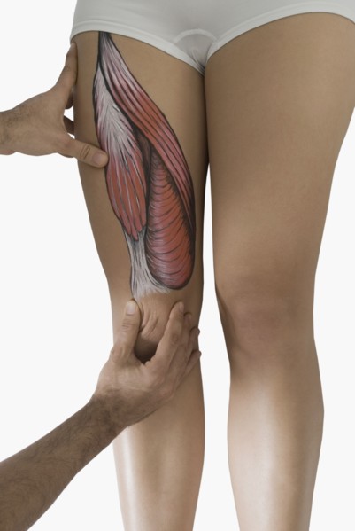 Chiropractor adjusting woman's leg