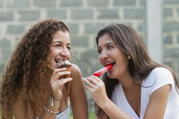 Hispanic friends eating ice cream together