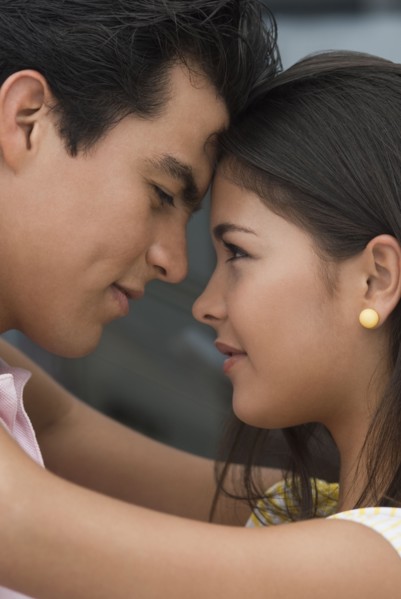 Hispanic couple hugging