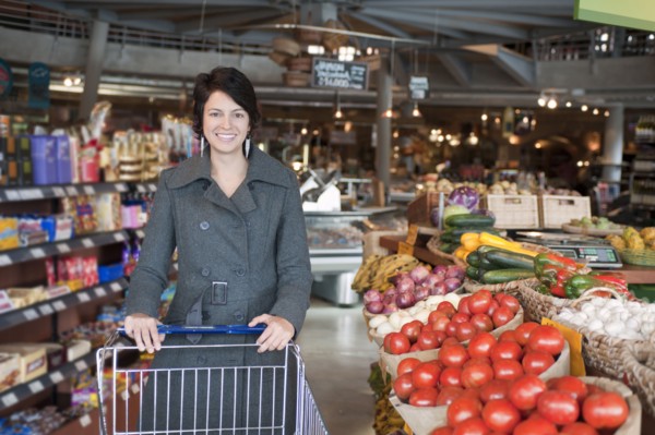 Hispanic woman shopping in grocery store
