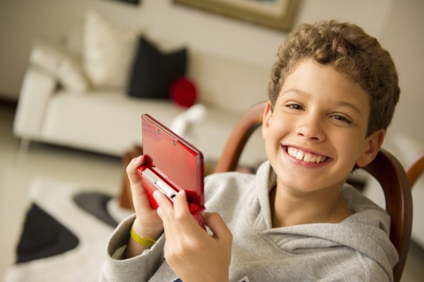 Hispanic boy playing video game