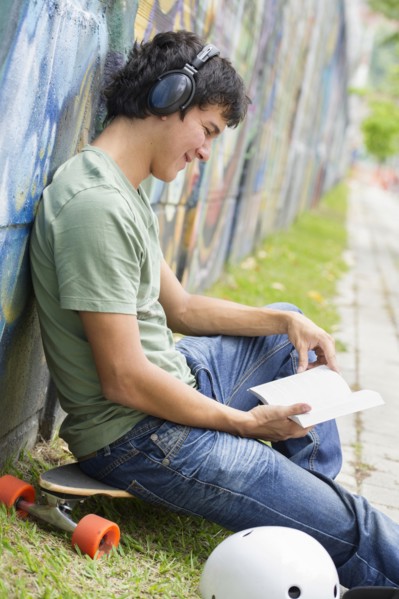 Hispanic man listening to headphones