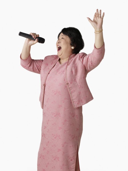 Confident Asian woman singing