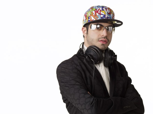 DJ in headphones with arms crossed