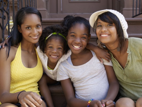 Mothers and daughters hugging