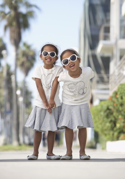 Young mixed race girls wearing sunglasses
