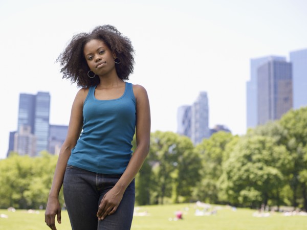 African woman standing in park