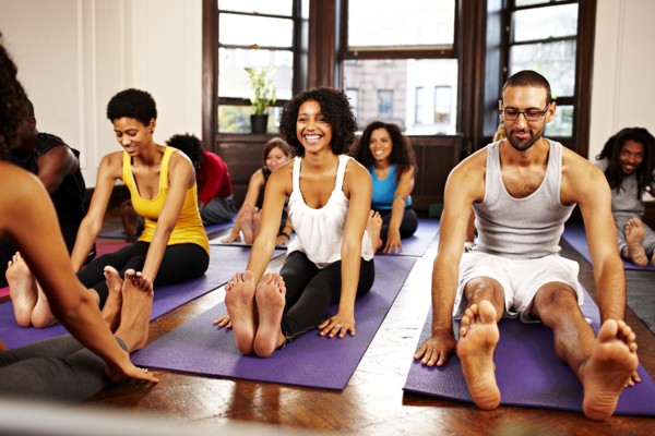 People practicing yoga in class