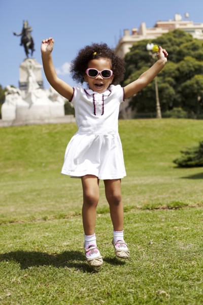 Mixed race girl playing in park