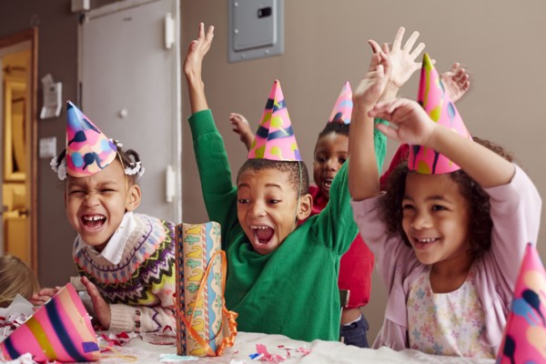 Children cheering at party