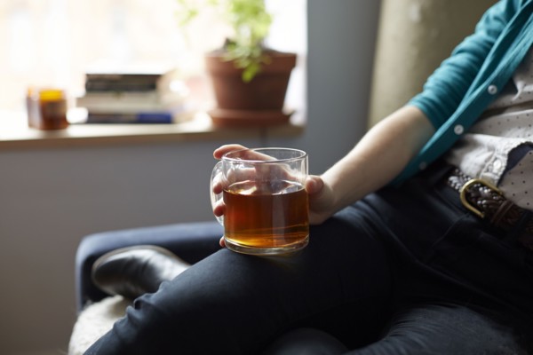 Close up of woman holding mug of tea