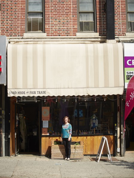 Caucasian woman standing outside store