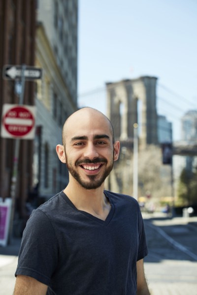 Smiling Hispanic man in city