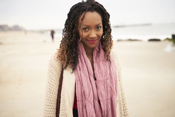 Black woman smiling on beach