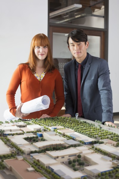 Business people examining scale model