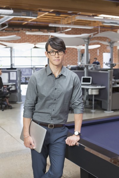 Businessman standing in office lounge area