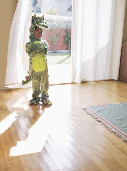 African American girl wearing dragon costume
