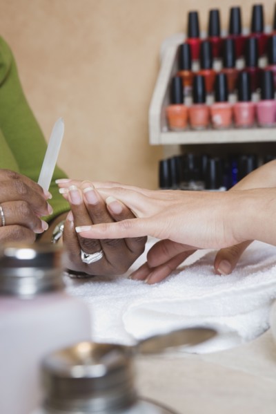 Close up of woman receiving manicure