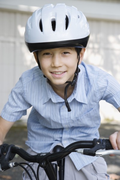 Asian boy riding bicycle