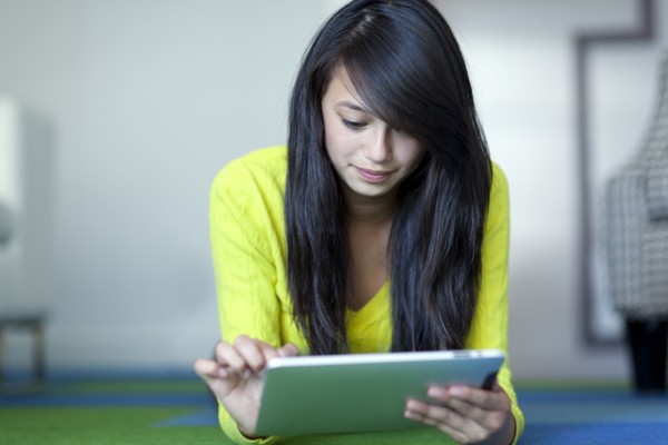 Asian girl using digital tablet