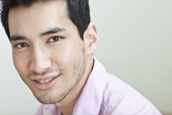 Smiling mixed race man