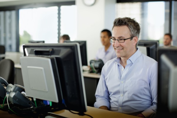 Business people working on computers in office