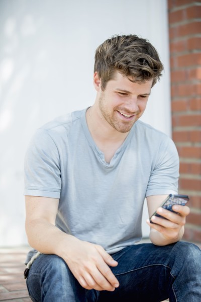 Man using cell phone outdoors