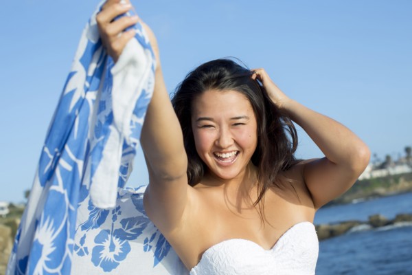 Japanese woman smiling on beach