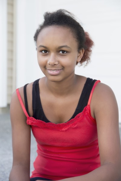 Mixed race girl smiling outdoors