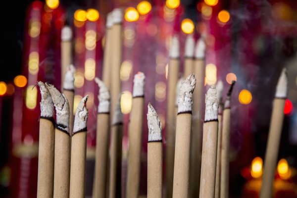 Burning incense in Buddhist temple