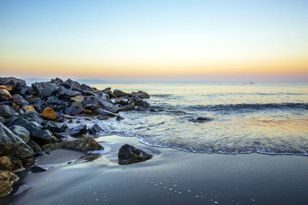 Waves washing up on rocky beach