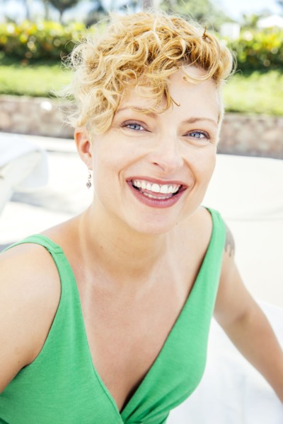 Caucasian woman smiling on beach