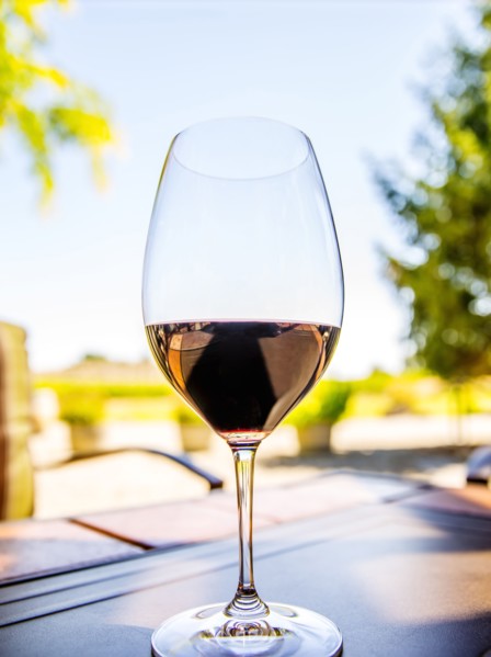 Close up of glass of wine on table