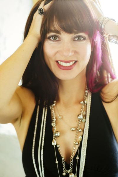 Caucasian woman with dyed hair smiling