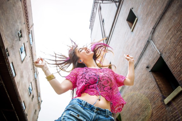 Low angle view of Caucasian woman dancing outdoors