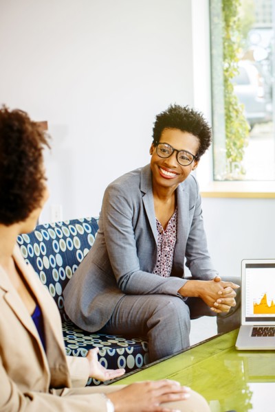 Businesswomen talking in office lobby