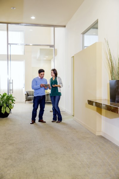 Business people talking in office hallway