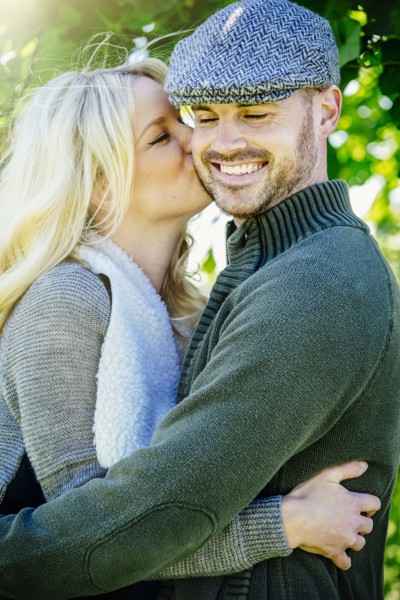 Caucasian couple kissing outdoors