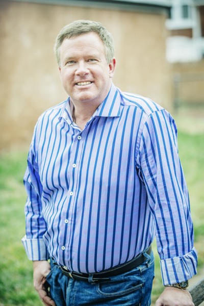 Close up of smiling Caucasian man standing outdoors
