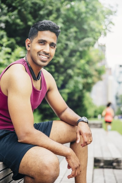 Indian athlete resting in city