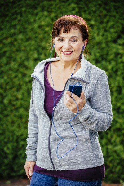 Caucasian woman listening to mp3 player