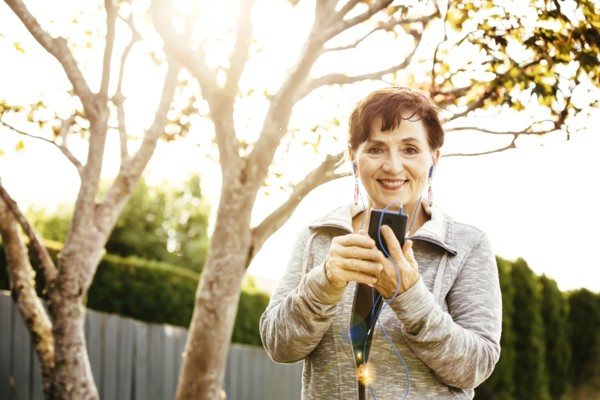 Caucasian woman using cell phone outdoors