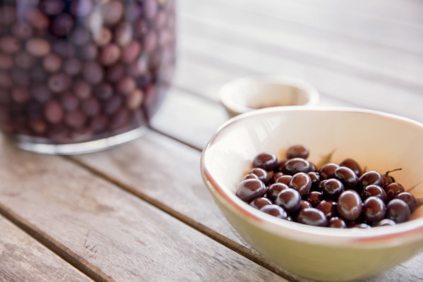 Bowl of olives on table