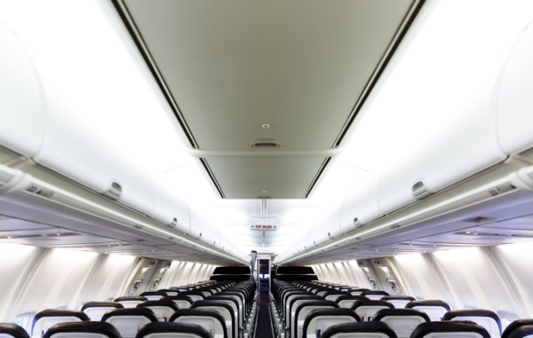 Empty chairs and compartments in airplane