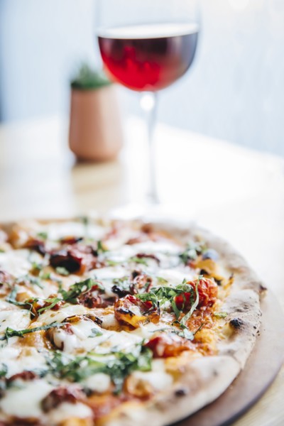 Glass of wine and pizza