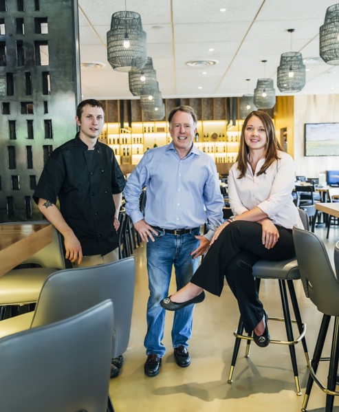 Caucasian men and woman smiling in restaurant