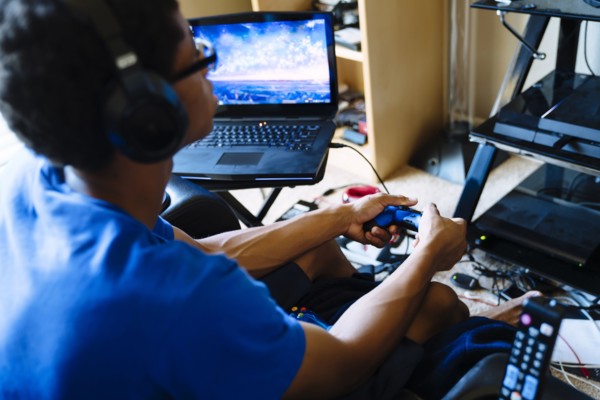 Black man playing video game