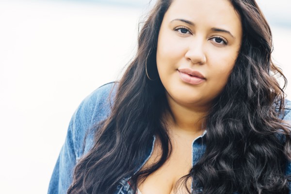 Serious Mixed Race woman near ocean